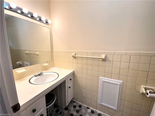 127 Forest Oaks Dr, Dobson, NC 27017 - bathroom with wainscoting, tile walls, and vanity