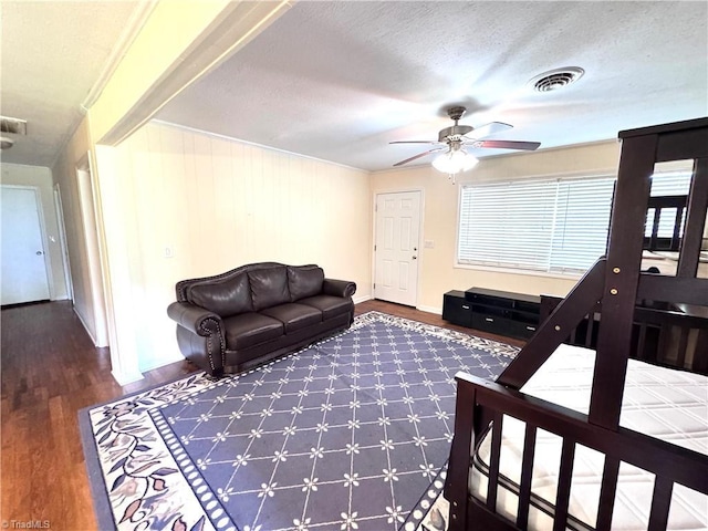 127 Forest Oaks Dr, Dobson, NC 27017 - living area featuring wood finished floors, a ceiling fan, baseboards, and a textured ceiling