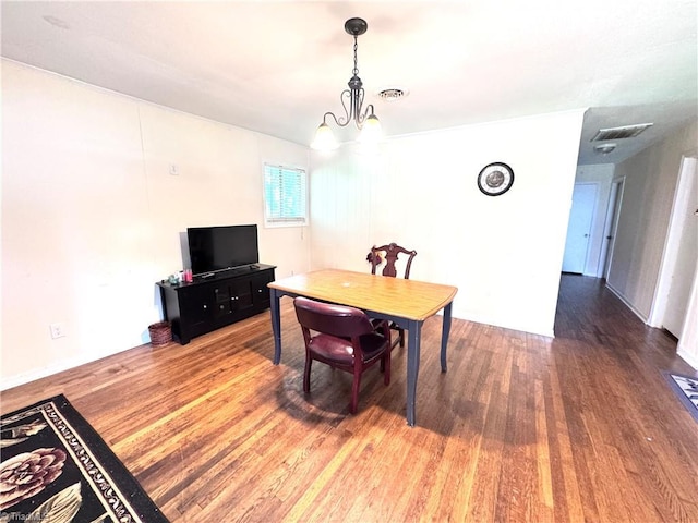 127 Forest Oaks Dr, Dobson, NC 27017 - dining area with wood finished floors and a chandelier