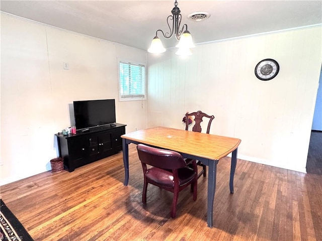 127 Forest Oaks Dr, Dobson, NC 27017 - dining area featuring wood finished floors and a chandelier