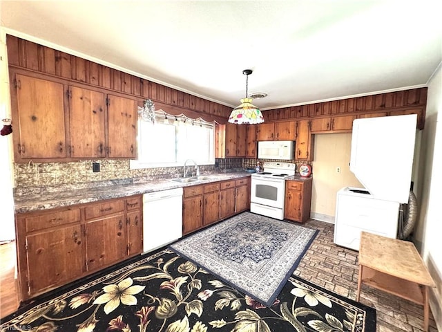 127 Forest Oaks Dr, Dobson, NC 27017 - kitchen featuring white appliances, a sink, backsplash, and brown cabinets