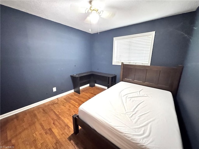127 Forest Oaks Dr, Dobson, NC 27017 - bedroom with wood finished floors, baseboards, and a ceiling fan