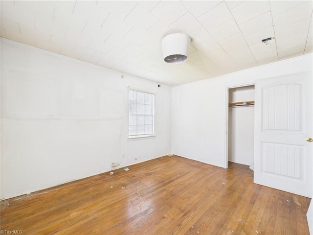 1008 E Brookline St, Winston-Salem, NC 27107 - unfurnished bedroom featuring wood-type flooring and a closet