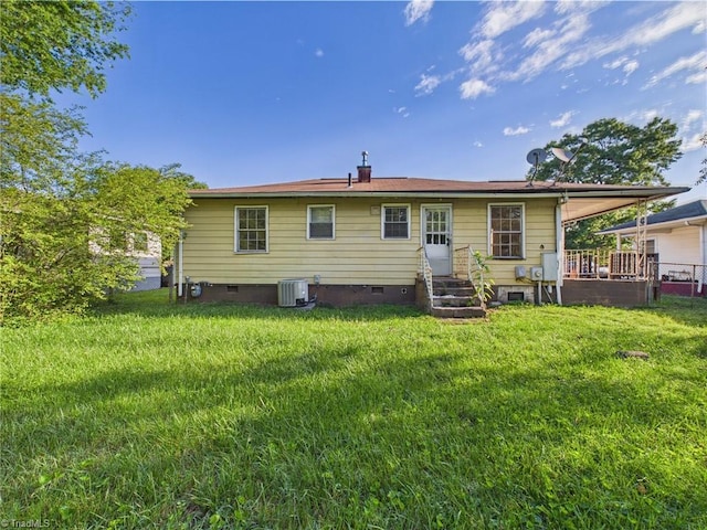 1008 E Brookline St, Winston-Salem, NC 27107 - back of property with crawl space, central AC unit, a lawn, and entry steps