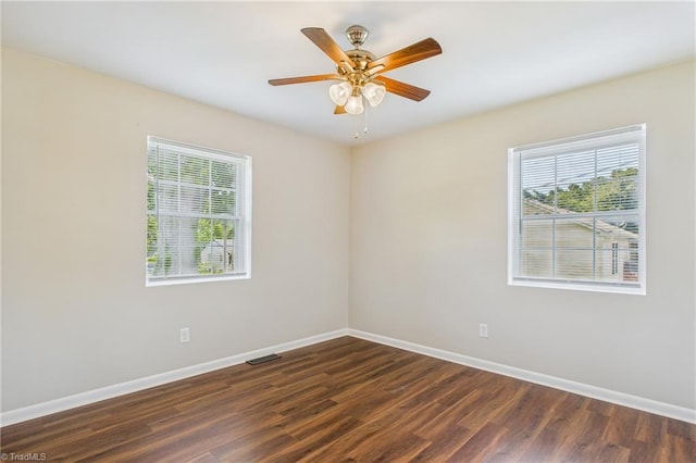 3640 Wyandotte Ave, Winston-Salem, NC 27127 - spare room with healthy amount of natural light, dark wood finished floors, and ceiling fan
