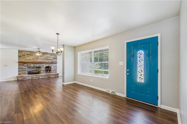 3640 Wyandotte Ave, Winston-Salem, NC 27127 - foyer entrance with a chandelier, dark wood-style floors, and a fireplace