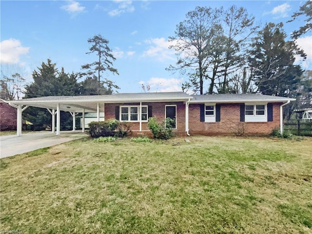 single story home with an attached carport, brick siding, fence, concrete driveway, and a front yard