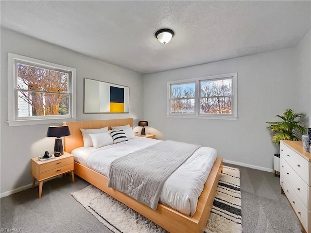 bedroom with carpet flooring and baseboards