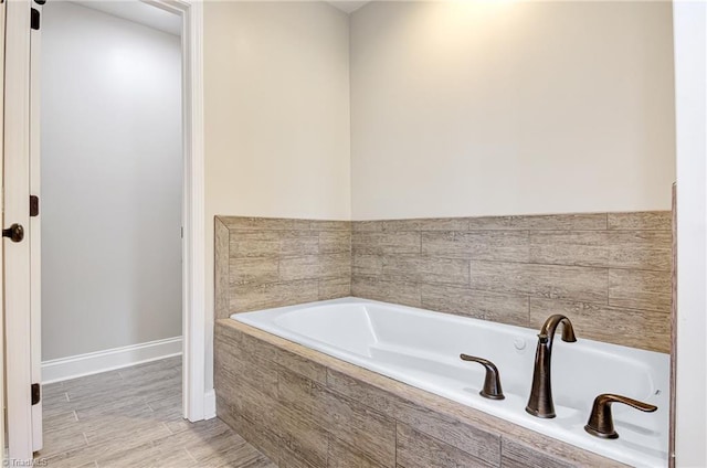 bathroom with tiled tub