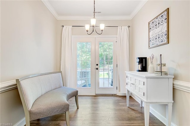 living area with french doors, crown molding, plenty of natural light, and dark wood-type flooring