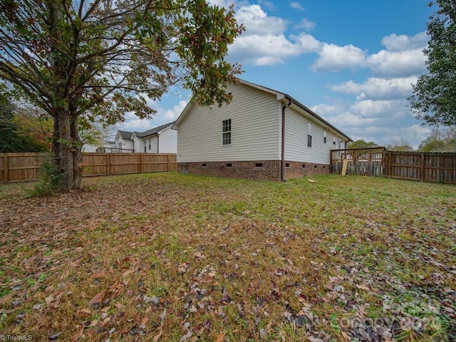 view of property exterior featuring a lawn