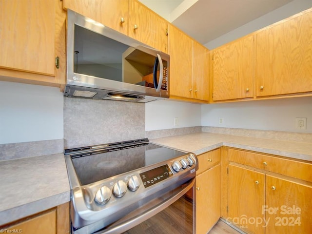 kitchen featuring light hardwood / wood-style flooring and stainless steel appliances