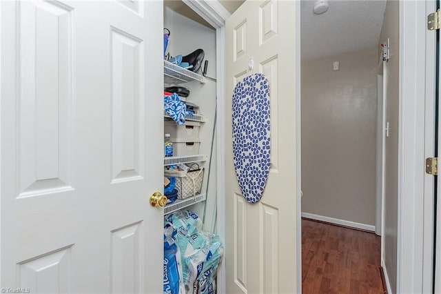 bathroom featuring wood finished floors and baseboards