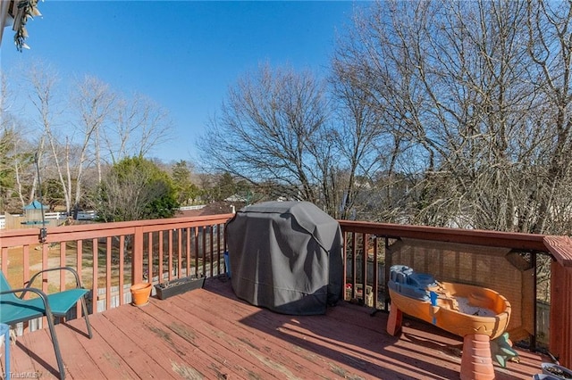 wooden terrace featuring area for grilling