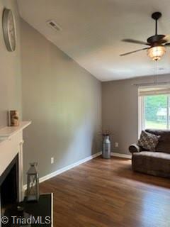 3569 Merry Ridge Rd, Tobaccoville, NC 27050 - living room featuring a ceiling fan, baseboards, wood finished floors, and a fireplace