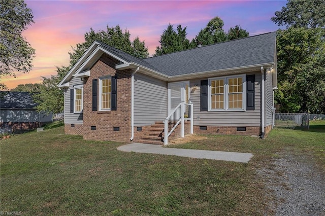 view of front of house with a yard