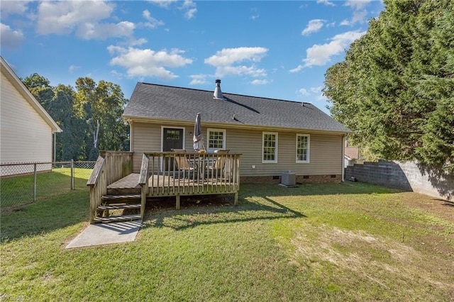 back of house featuring a lawn, central AC, and a deck