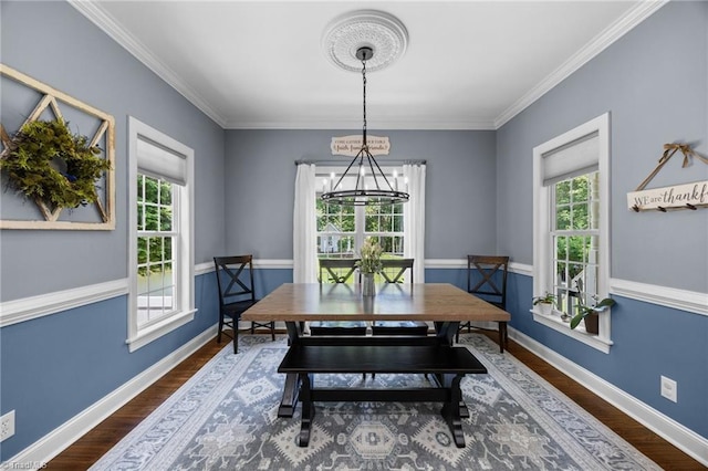 8483 Austin Hill Ln, Tobaccoville, NC 27050 - dining room with a chandelier, dark wood-type flooring, and crown molding