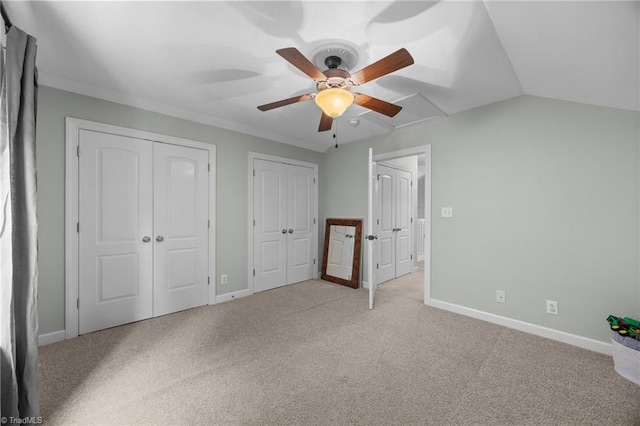 8483 Austin Hill Ln, Tobaccoville, NC 27050 - unfurnished bedroom featuring multiple closets, carpet, a ceiling fan, and crown molding