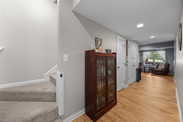 8483 Austin Hill Ln, Tobaccoville, NC 27050 - hall with stairway, recessed lighting, and light wood-style flooring