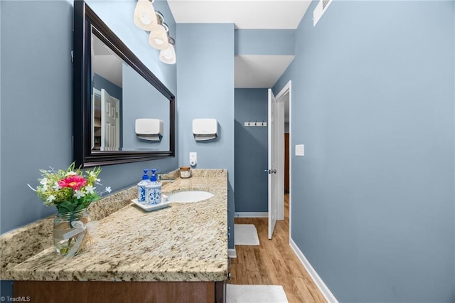 8483 Austin Hill Ln, Tobaccoville, NC 27050 - bathroom featuring wood finished floors and vanity