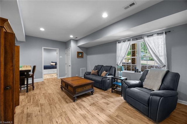 8483 Austin Hill Ln, Tobaccoville, NC 27050 - living area with light wood-style floors and recessed lighting