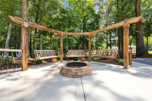 8483 Austin Hill Ln, Tobaccoville, NC 27050 - view of patio / terrace with an outdoor fire pit and view of wooded area
