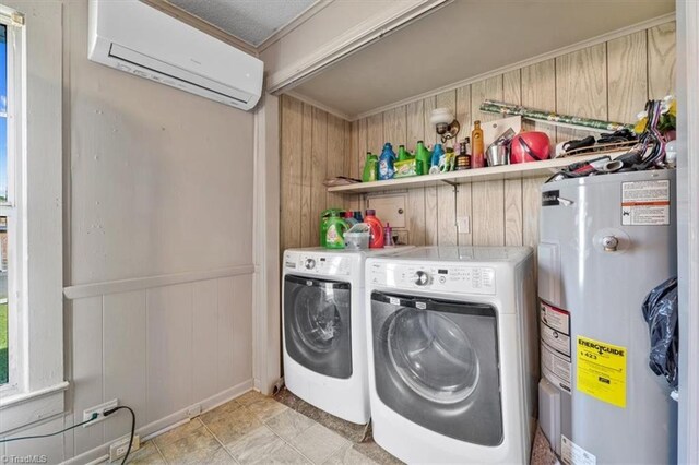 laundry room with light tile patterned floors, crown molding, washing machine and clothes dryer, an AC wall unit, and water heater