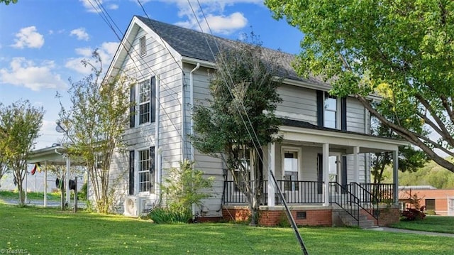 back of property featuring a porch and a yard