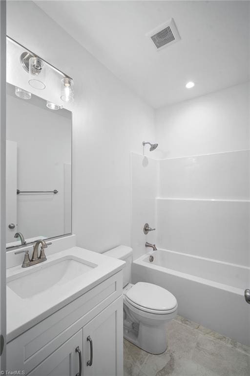 full bathroom with vanity, bathing tub / shower combination, and toilet