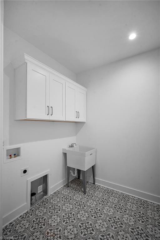 washroom with cabinets, washer hookup, and electric dryer hookup