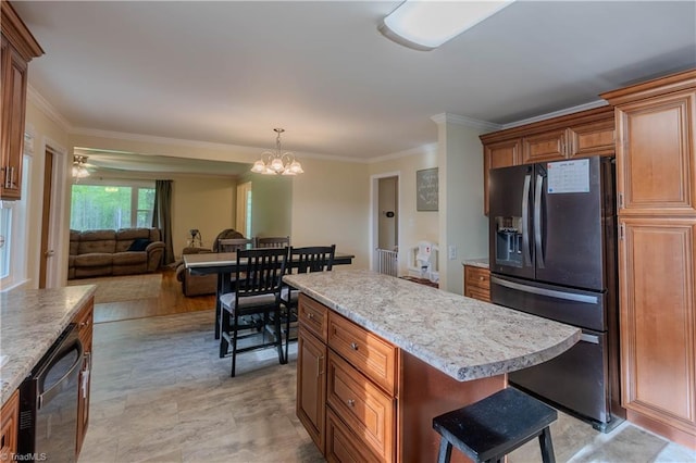 kitchen featuring black refrigerator with ice dispenser, crown molding, brown cabinetry, light countertops, and a kitchen island
