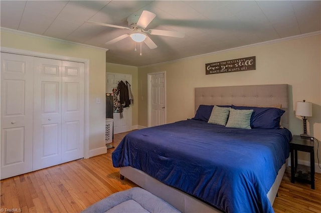 bedroom with hardwood / wood-style floors, a ceiling fan, a closet, and crown molding