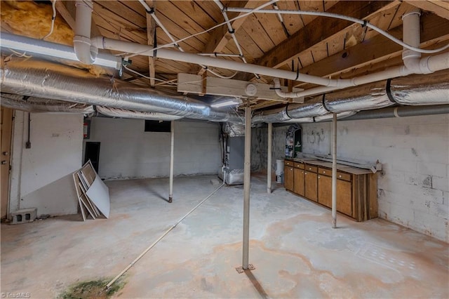 unfinished below grade area featuring heating unit
