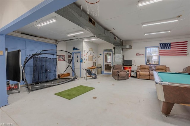 game room featuring concrete flooring