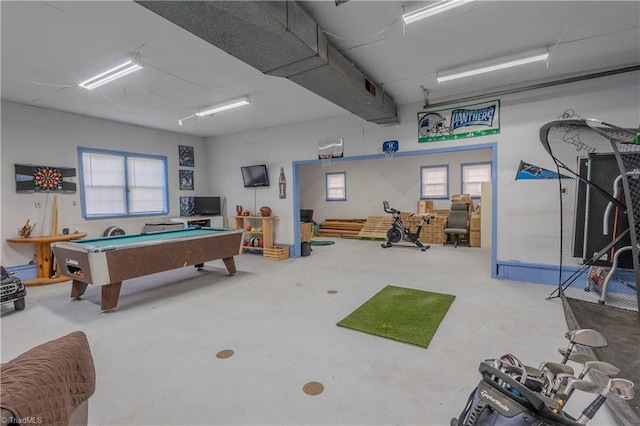 game room featuring concrete floors, a wealth of natural light, and billiards