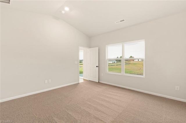 1047 Russell Dr, Winston-Salem, NC 27127 - carpeted spare room with baseboards, lofted ceiling, and visible vents