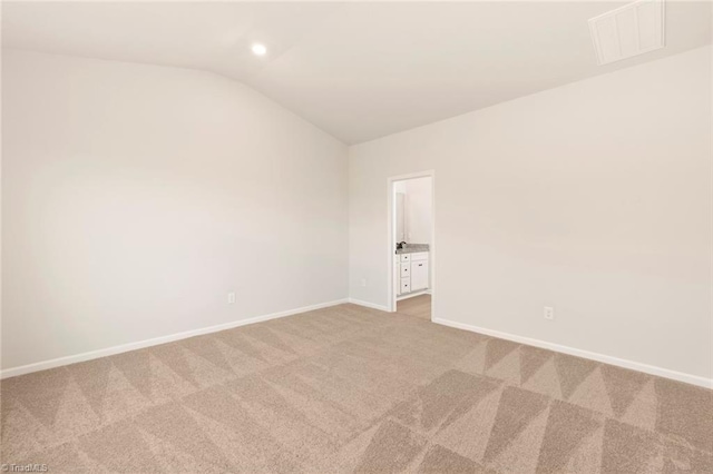 1047 Russell Dr, Winston-Salem, NC 27127 - unfurnished room featuring lofted ceiling, baseboards, light colored carpet, visible vents, and recessed lighting