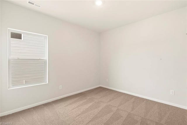 1047 Russell Dr, Winston-Salem, NC 27127 - empty room with light colored carpet, visible vents, and baseboards