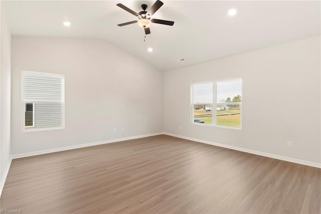 1047 Russell Dr, Winston-Salem, NC 27127 - unfurnished room with baseboards, lofted ceiling, wood finished floors, and a ceiling fan