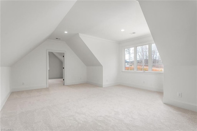 additional living space featuring recessed lighting, light carpet, visible vents, and baseboards