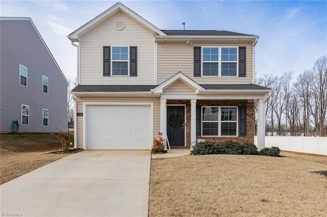 view of front of home with a garage and a front lawn