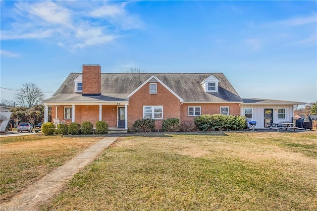 view of front of property with brick siding and a front lawn