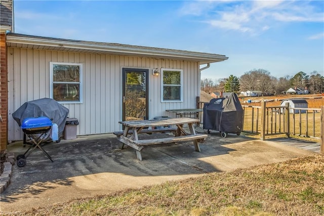 view of patio with fence and grilling area