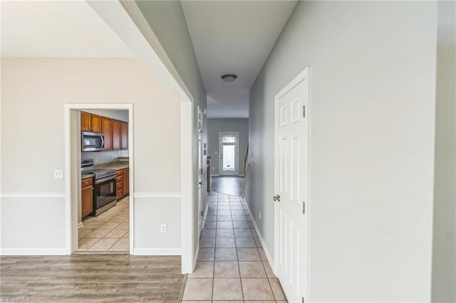 hallway featuring light wood-type flooring