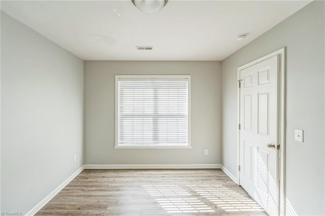 spare room with light wood-type flooring