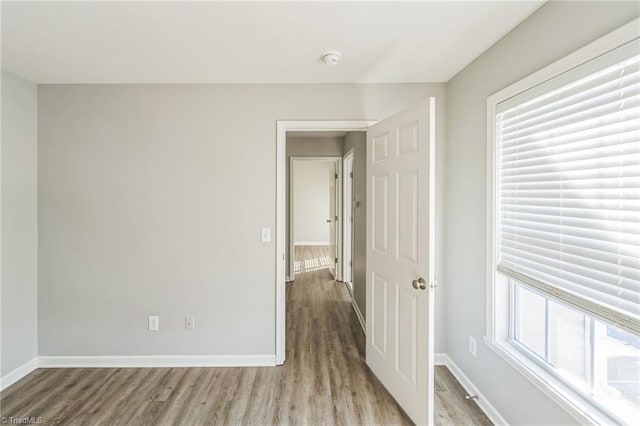 unfurnished room featuring light wood-type flooring