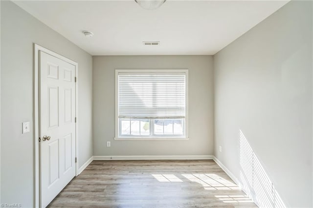 unfurnished room featuring light hardwood / wood-style flooring