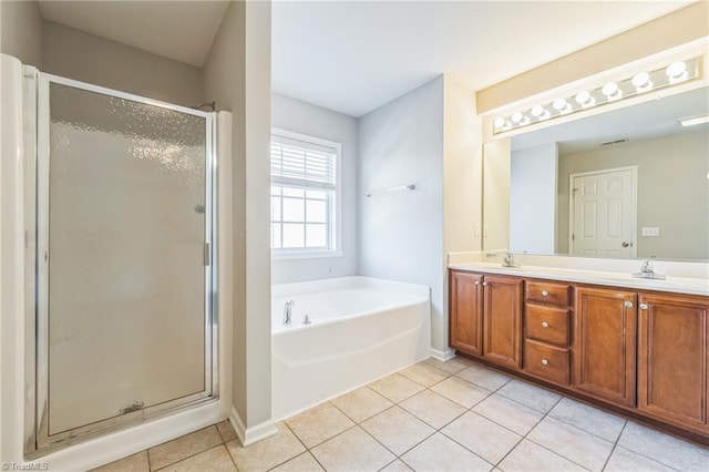 bathroom with vanity, independent shower and bath, and tile patterned floors