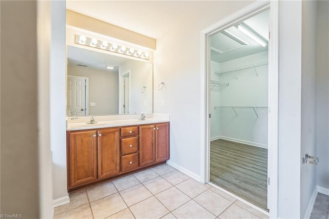 bathroom with vanity and wood-type flooring